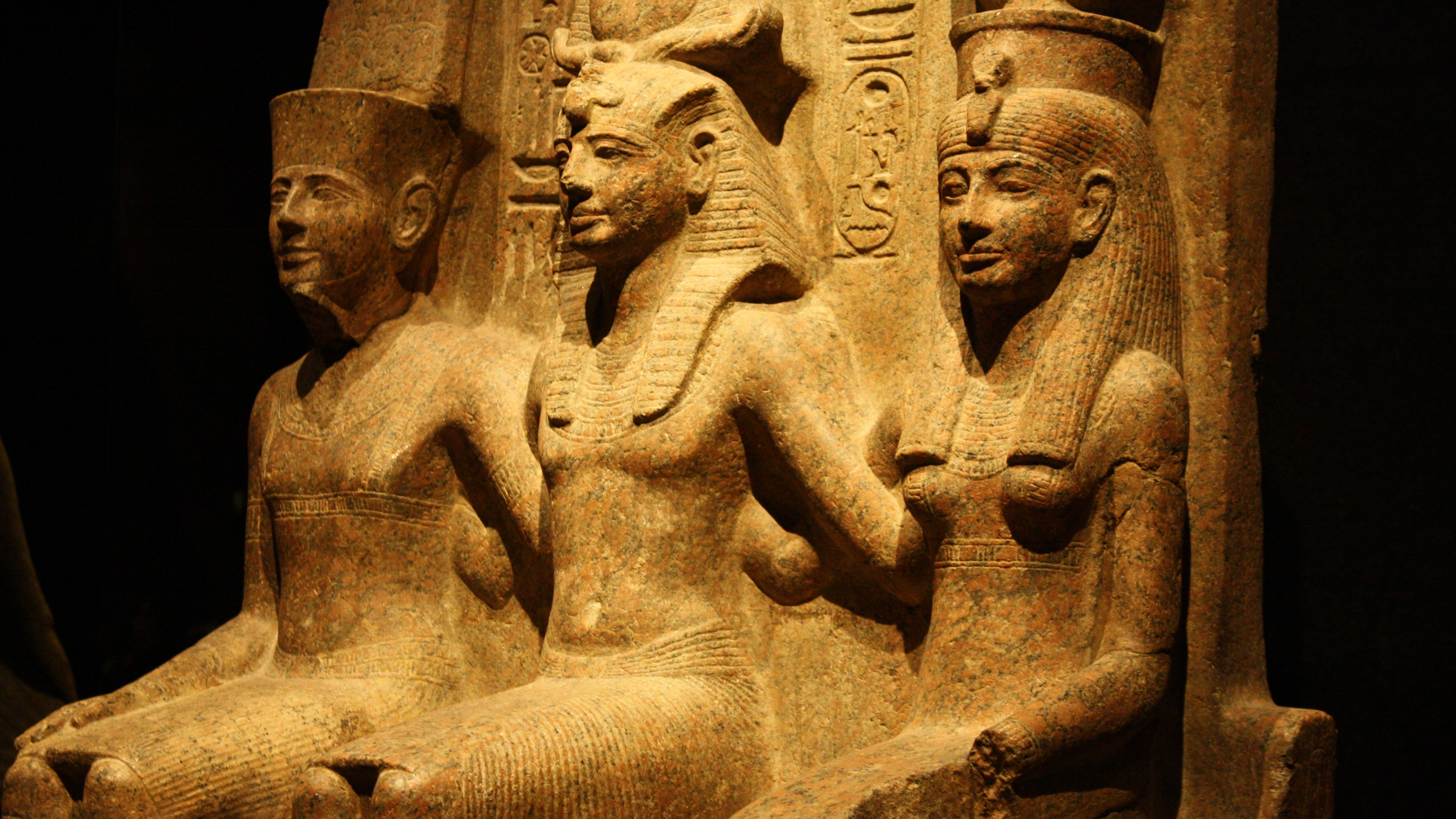 A granite monument depicting the god Amun, Ramesses II, & the goddess Mut from the Temple of Amun in Thebes. Image by Mark Cartwright, courtesy World History Encyclopedia, CC BY-NC-SA 4.0.