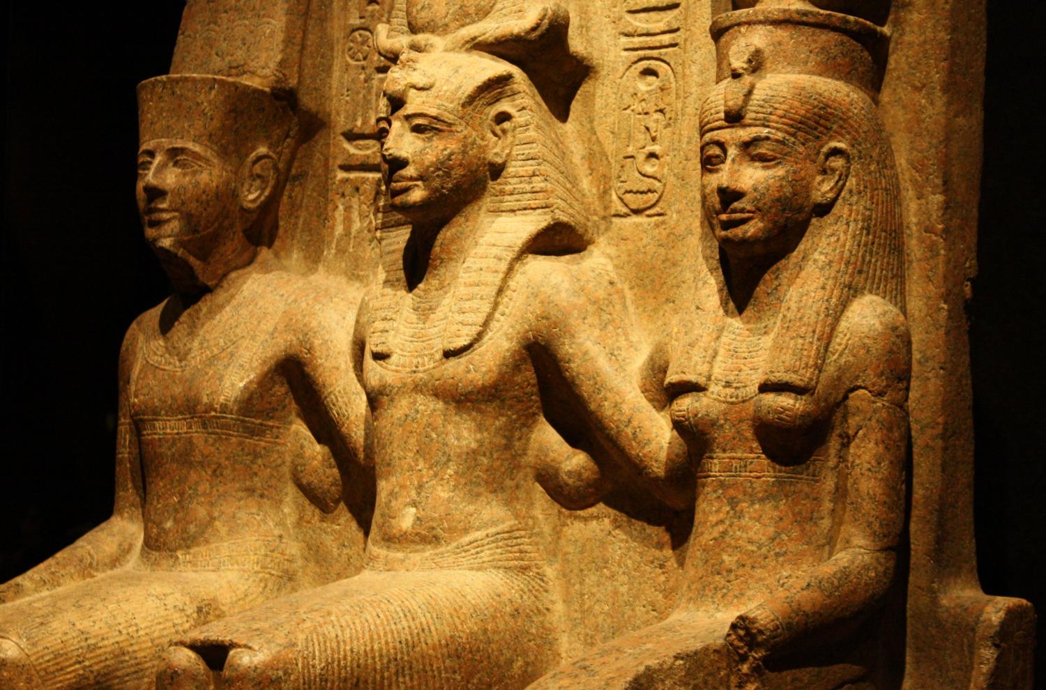 A granite monument depicting the god Amun, Ramesses II, & the goddess Mut from the Temple of Amun in Thebes. Image by Mark Cartwright, courtesy World History Encyclopedia, CC BY-NC-SA 4.0.